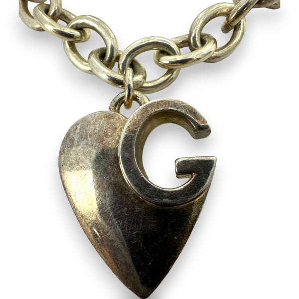 Pulsera Gucci de plata de ley 925 con dije de corazón G y logotipo de 19 cm. Fabricada en Italia.