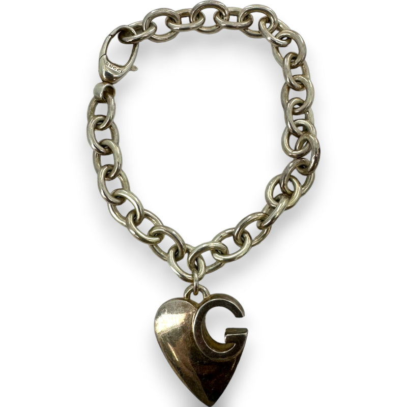 Pulsera Gucci de plata de ley 925 con dije de corazón G y logotipo de 19 cm. Fabricada en Italia.